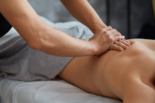 Massage therapy session supporting muscle recovery at Atom Olson Fitness