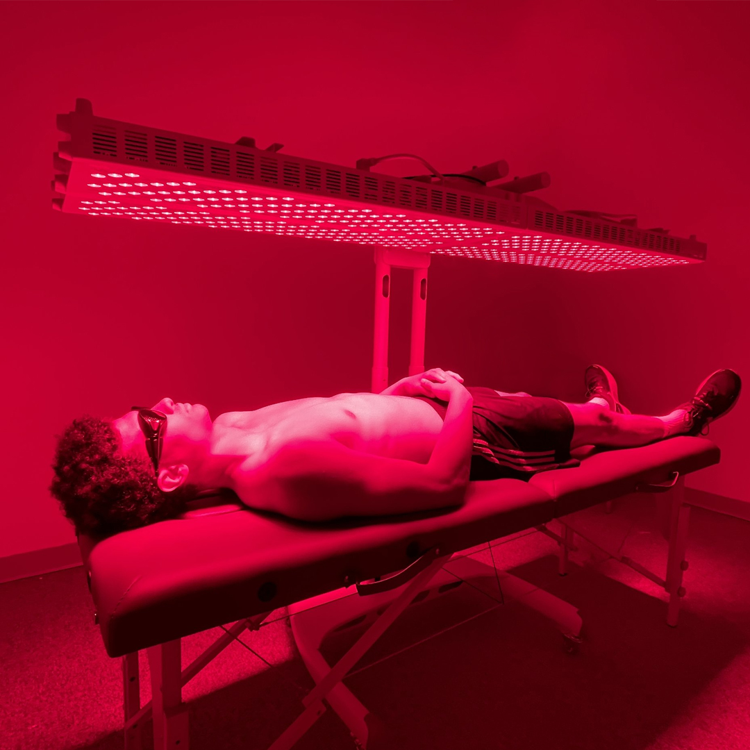 Atom Olson Fitness member using red light therapy during a recovery session